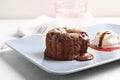 Plate of delicious fresh fondant with hot chocolate and ice cream on table. Lava cake recipe Royalty Free Stock Photo