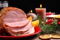 Plate with delicious ham served on wooden table. Christmas dinner Royalty Free Stock Photo