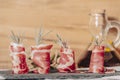 Plate of delicious Iberian ham on a wooden table background. Appetizing slices Iberian ham. Acorn-fed Iberico Ham. Royalty Free Stock Photo