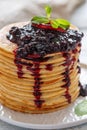 Stack of pancakes with berry sauce.