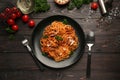 Plate with delicious pasta bolognese on dark wooden table Royalty Free Stock Photo