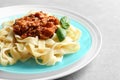 Plate with delicious pasta bolognese on table Royalty Free Stock Photo