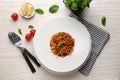 Plate with delicious pasta bolognese on white wooden table, top view Royalty Free Stock Photo