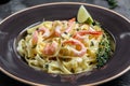 A plate of delicious shrimp alfredo with garlic and cream sauce over fettuccine pasta. Italian food, top view. Food recipe Royalty Free Stock Photo