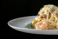 A plate of delicious shrimp alfredo with garlic and cream sauce over pasta. Royalty Free Stock Photo