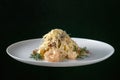 A plate of delicious shrimp alfredo with garlic and cream sauce over pasta. Royalty Free Stock Photo