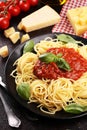 Plate of delicious spaghetti Bolognaise or Bolognese with savory minced beef and tomato sauce garnished with parmesan Royalty Free Stock Photo