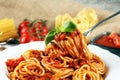 Plate of delicious spaghetti Bolognaise or Bolognese with savory minced beef and tomato sauce garnished with parmesan Royalty Free Stock Photo