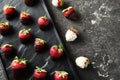 Plate with delicious strawberry covered with chocolate on grey textured background Royalty Free Stock Photo