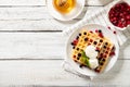 Plate with delicious waffles with berries and ice cream. Top view, place for text Royalty Free Stock Photo