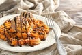 Plate with delicious waffles and ice cream on table, closeup Royalty Free Stock Photo