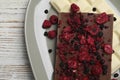 Plate and different chocolate bars with freeze dried fruits on white wooden table, top view Royalty Free Stock Photo