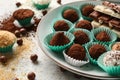 Plate with different tasty chocolate truffles on table Royalty Free Stock Photo