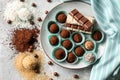 Plate with different tasty chocolate truffles on table Royalty Free Stock Photo