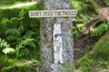 The plate: Don`t feed the trolls in forest in Norway. Royalty Free Stock Photo