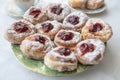 A plate of donuts filled with jam and coated in sugar Royalty Free Stock Photo