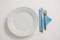 Plate with eating utensils and napkin Royalty Free Stock Photo