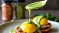 Plate of eggs and meat with a green sauce on top Royalty Free Stock Photo