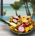 plate of exotic fruits on tropical beach