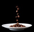 Plate with falling coffee grain Royalty Free Stock Photo