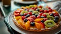 A plate features fruit pizza on a table Royalty Free Stock Photo