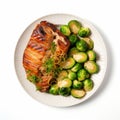 Top View Croissant Dish With Roasted Salmon Steak And Brussels Sprouts