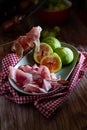 Plate of figs and raw ham, a typical Italian appetizer Royalty Free Stock Photo
