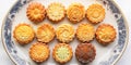 A plate filled with different kinds of moon cakes