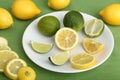 Plate filled with slices of lemons and limes