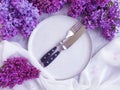 plate, flower lilac breakfast a concrete background