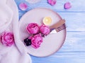 Plate, flower rose, romantic serving retro wedding setting candle on wooden background decoration Royalty Free Stock Photo