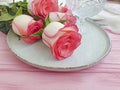 Plate flower rose on wooden background season rustic spring Royalty Free Stock Photo