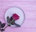 Plate flower rose wooden backgroundn rustic