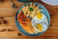 A plate of food with a fried egg and a piece of meat Royalty Free Stock Photo