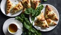 A plate of food with spinach and a cup of tea