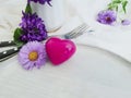 Plate, fork, knife, heart, romance design chrysanthemum flower on white wooden background Royalty Free Stock Photo