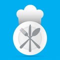 Plate with fork, knife and spoon a a chef hat on blue background Royalty Free Stock Photo
