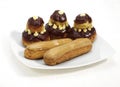 PLATE WITH FRENCH CAKES CALLED CHOCOLATE RELIGIEUSE AND COFFE ECLAIR