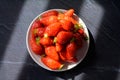 Plate with french red ripe sweet strawberries Fraises de Plougastel, harvested in France