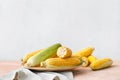 Plate with fresh corn cobs on table Royalty Free Stock Photo