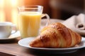 Plate of fresh croissants on beige background, ideal for bakery or food-themed designs
