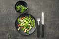 Plate with fresh green peas salad on grey background Royalty Free Stock Photo