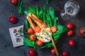 A plate with fresh green raw spinach and fried wild salmon, tomatoes and cream cheese sauce Royalty Free Stock Photo