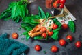 A plate with fresh green raw spinach and fried wild salmon, tomatoes and cream cheese sauce Royalty Free Stock Photo