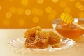 Plate with fresh honeycombs on table