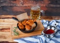 A plate of fresh, hot, crispy fried chicken with red sause on a Royalty Free Stock Photo