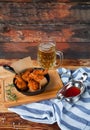 A plate of fresh, hot, crispy fried chicken with red sause on a Royalty Free Stock Photo