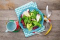 Plate with fresh salad, measure tape, cup, knife and fork. Diet Royalty Free Stock Photo