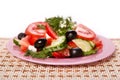 Plate of fresh salad on the napkin