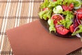 Plate with fresh salad of raw tomatoes and lettuce Royalty Free Stock Photo